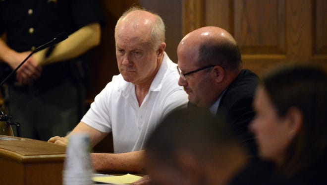 John Gates sits next to his attorney Scott Wood Thursday, Sept. 11, 2014, in Fairfield County Common Pleas Court in Lancaster as Judge Richard Berens reads the verdicts in the case. Gates was found guilty of attempted murder.