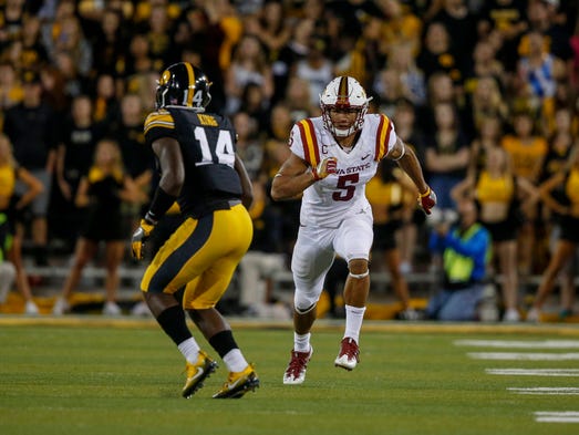 Iowa State receiver Allen Lazard, right, runs a play