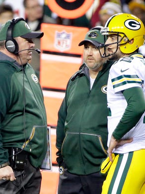 Packers coach Mike McCarthy talks with quarterback Aaron Rodgers (12) on the sidelines during the game against the Washington Redskins at FedEx Field.