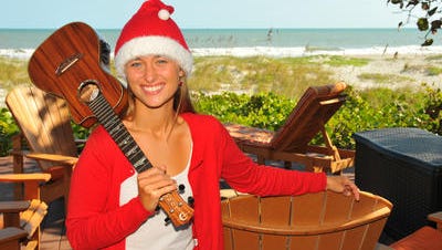 Anna Lusk, Merritt Island, is the voice behind the Surfing Santa video.