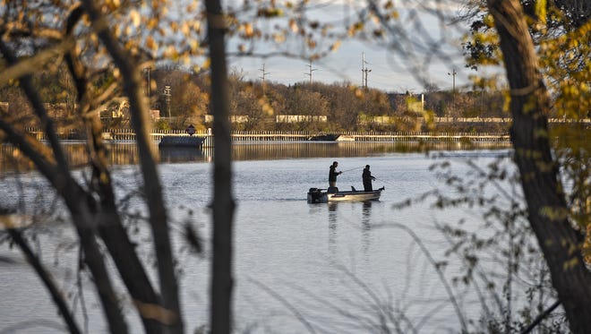 Anglers try their luck on the Mississippi River just above the Sartell dam.