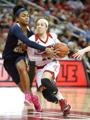 Louisville's Briahanna Jackson is guarded closely by Pitt's Destinie Gibbs. Feb. 28, 2016.