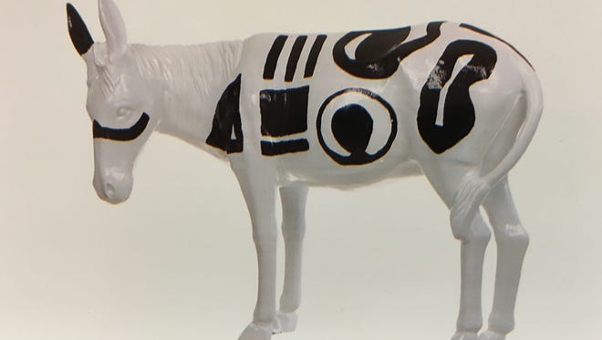 This is a photograph of a painted aluminum burro stolen from the porch of Patsy Sanchez's business in Carrizozo.