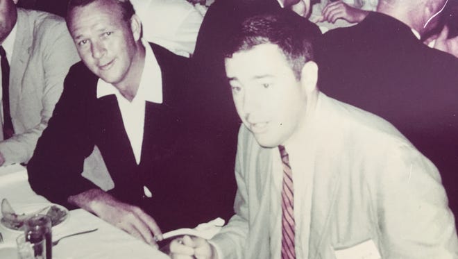 Richard Colgan, foreground, sits with Arnold Palmer at Locust Hill Country Club in 1966. Palmer, Jack Nicklaus, Doug Sanders and Bruce Devlin played in a charity Pro-Am Tournament Colgan helped organize.