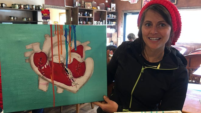 Ruidoso artist Whitney Hobson is putting some of her paintings out in public spaces to be enjoyed -- and even taken away -- by anyone who likes them.