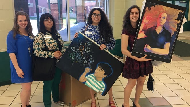 Incarnate Word Academy students Ashley Elliott (from left), Millicent Alvarado, Franceska Alvarado, and Vanessa Zambrano participated in the Visionarios 2017 Youth Art Contest on Saturday, February 25, 2017.