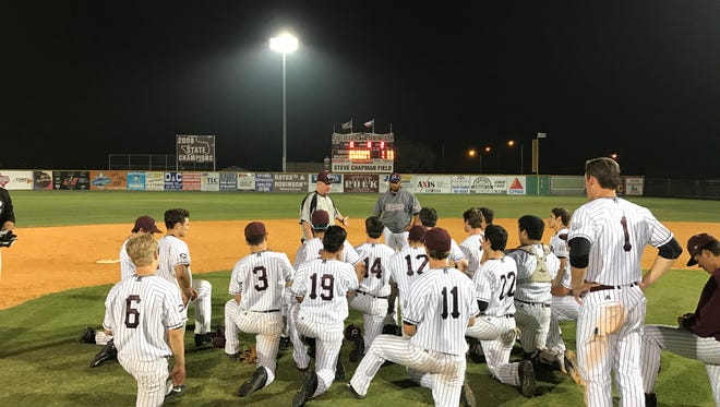 Calallen coach Steve Chapman talks to his team after Tuesday's 4-3 win against Ray at Chapman Field.