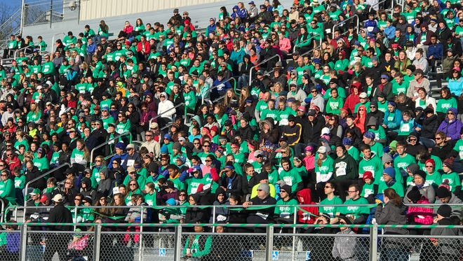 A huge crowd displayed a sea of green in support of Sunday's Super Jess 5K at Canton High School.