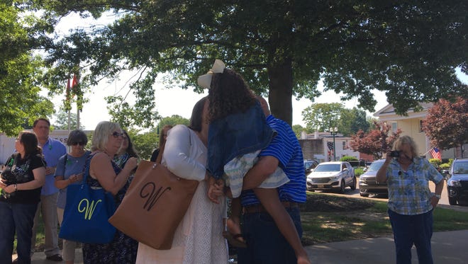 Wendi Wright, right, hugs her daughter and father Albert, left, before going into a preliminary hearing Friday, June 2 at the Weakley County Courthouse.