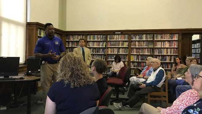 Montclair police officer Travis Davis, in front, addresses residents during a First Ward meeting on June 1. Behind him is Deputy Mayor and First Ward Councilmember Bill Hurlock.