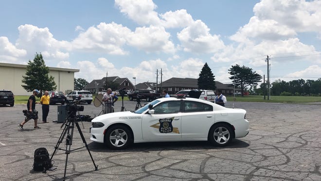 Sergeant John Perrine and Captain Mike Pruitt sit inside a 120 degree car to bring attention to the dangers of leaving children or pets in hot cars.