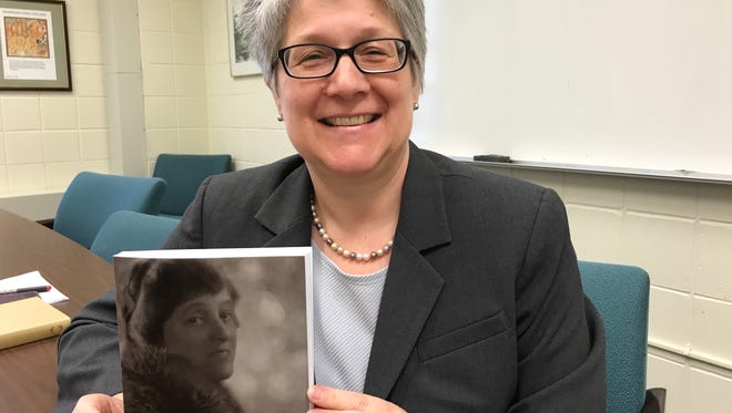 George Court University Professor Mary Chinery with a copy of the Edith Wharton Review. Chinery and her research partner recently tracked down a Wharton play that had been missing since 1901.