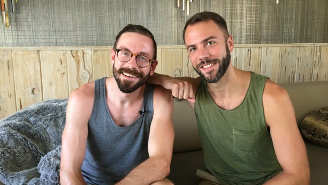 Kit Williamson on left and John Halbach on right, sit inside the "Burton House" in Palm Springs where they are filming an episode of their TV show "Eastsiders."