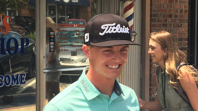 PGA Tour player and former Auburn star Blayne Barber outside a local barber shop for a promotional event for the 2017 Barbasol Championships.