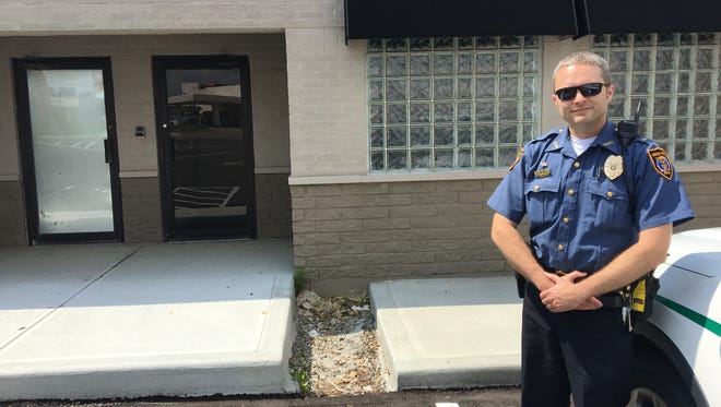 Lt. Mitch Hill with Green Township Police Department stands next to the department's new training center which began operation earlier this year. The center is located at 2808 Blue Rock Road.