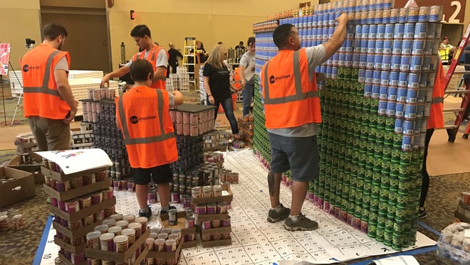 Teams participate in the eleventh annual Canstruction event at the Phoenix Convention Center, July 29, 2017.