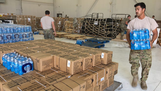 Soldiers with the Combat Aviation Brigade at Fort Bliss on Tuesday loaded up bottled water and MREs to sustain themselves while doing relief efforts in east Texas in the wake of Hurricane Harvey.