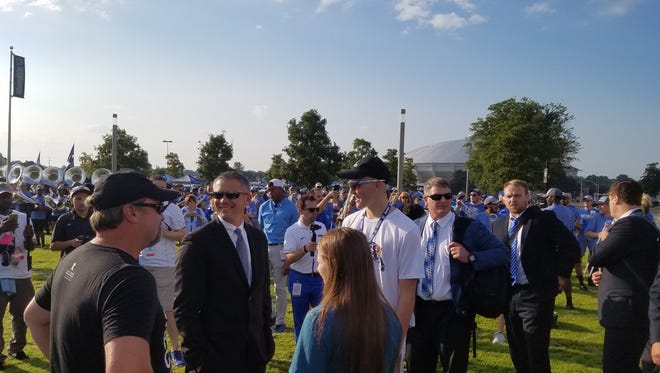 St. Jude patient Wyatt Deel (right) helped coach Mike Norvell lead the Memphis football team during the Tiger Walk before Saturday's game against UCLA at the Liberty Bowl.