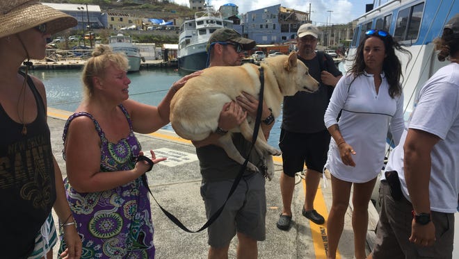 Residents and their pets evacuate off of St. John as Hurricane Maria takes aim at the isolated island.