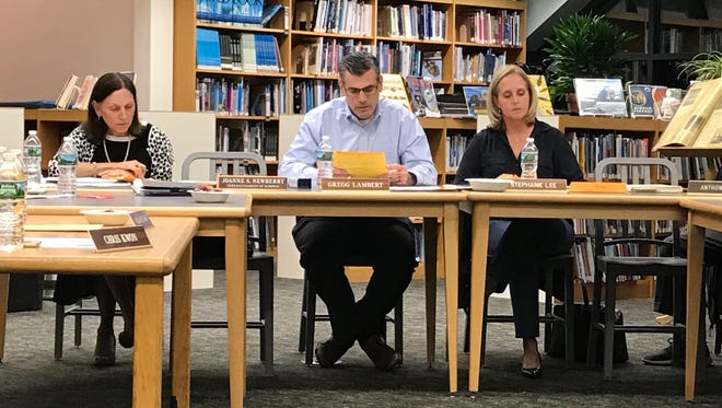 School Board President Gregg Lambert reads a statement at the Oct. 12 Closter Board of Education meeting, stating school board members cannot comment on personnel issues.
