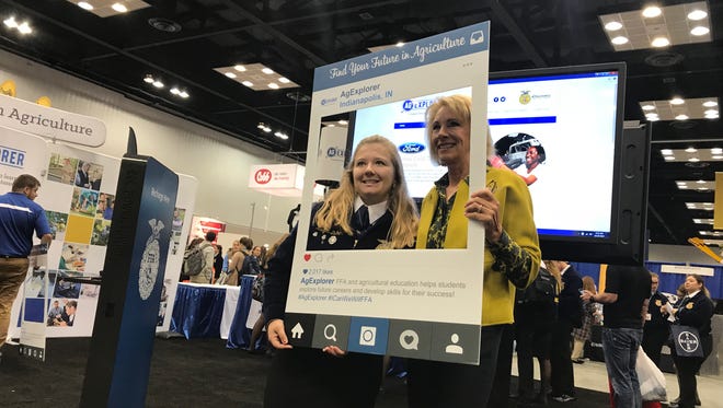 U.S. Secretary of Education Betsy DeVos (right) poses with Reagan Dalke at the National FFA Convention and Expo in downtown Indianapolis on Friday, Oct. 27, 2017.