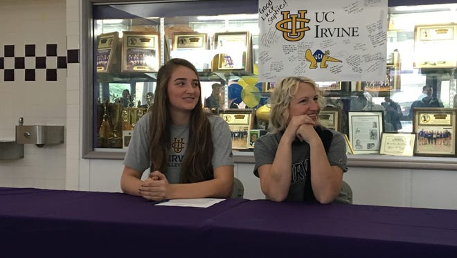 Shasta's Sophie Wood (left) signs her letter of intent to play volleyball at UC Irvine.