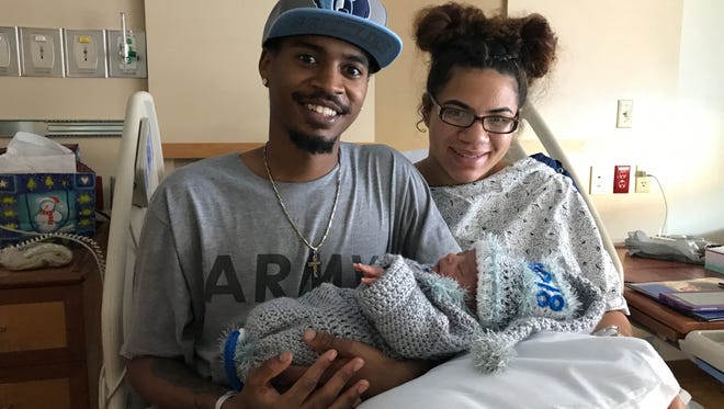 Naassire Smallwood and Alexus Eaton hold their daughter, Leilani Smallwood, York County's first baby of 2018.
