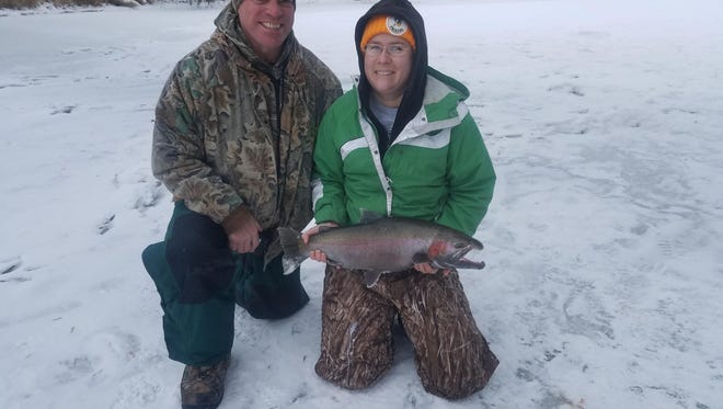 Woodland Dunes Land Manager Jennifer Klein recently caught a steelhead trout while ice fishing on the Sheboygan River.