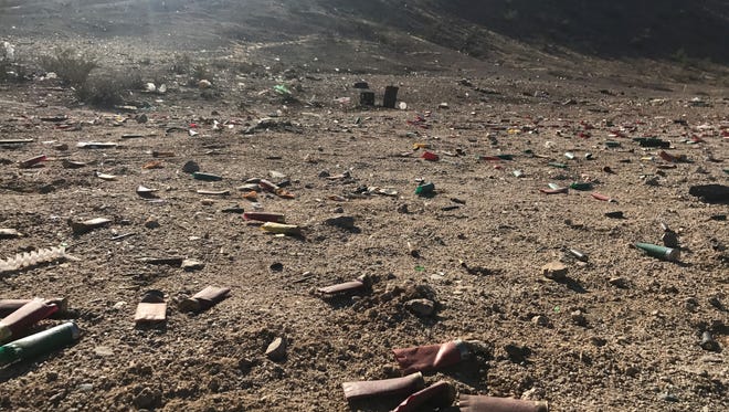 Shotgun shells lie on the ground near Tonopah Salome Highway in Buckeye. Kami Gilstrap was killed by a stray bullet in the area on January 14, 2018.