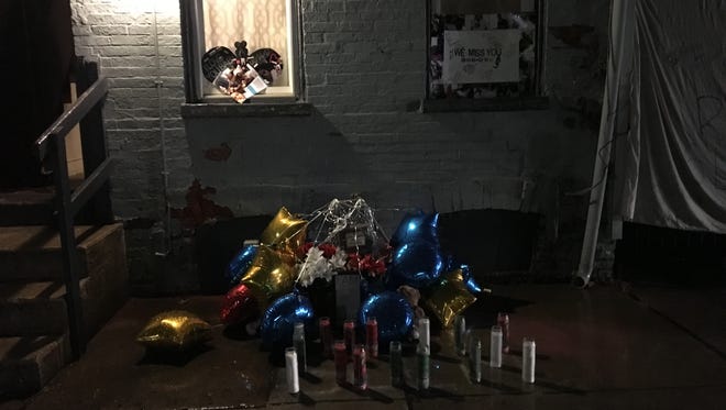 A vigil was held for Matthew "Slim" Bell Thursday night. Bell was killed Feb. 12. A few signs were tacked up and balloons and candles were displayed in front of the house in the 200 block of Penn Street where Bell was killed.