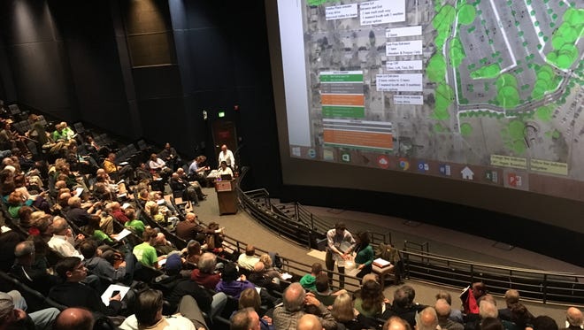 About 150 people attend a presentation of a plan for parking improvements at the Memphis Zoo.