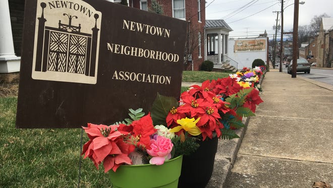 Faux flowers line West Beverley Street in honor of Myrtle Cason, who decorated her Newtown home with hundreds of fake flowers. She recently had to move into an assisted living facility.