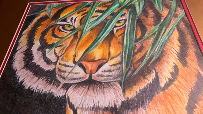 One of the paintings Larry Owens was selling at a Baltimore flea market stall. He starting to paint and draw to deal with what was once a life sentence in prison.