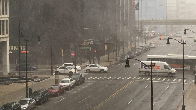 A dusting of snow falls in Downtown Detroit.