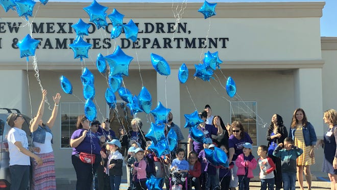 Children and their families helped the Children, Youth and Families Department staff bring awareness to child abuse and neglect during a balloon release on Monday at 918 E. Pear St.