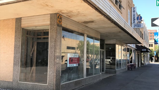 A yellow fallout shelter sign is on the corner of the building at 202 Pine St. Grain Theory Brewing Co. hopes to open in spring 2019 on the second floor of the building.