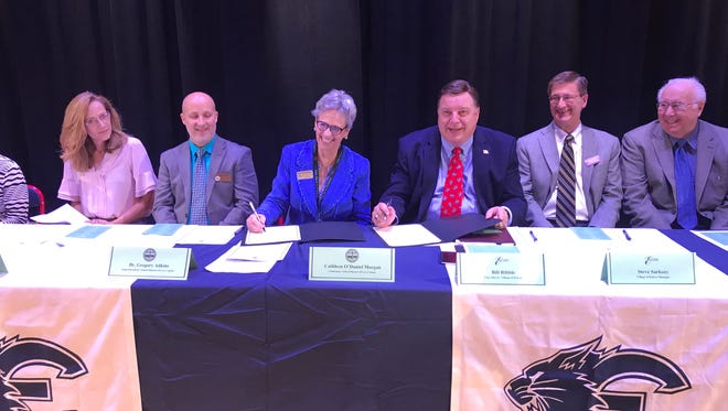 The village of Estero and the Lee County School District signed a partnership agreement Monday, May 21, at Estero High School.