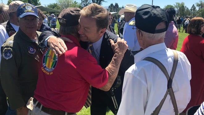 U.S. Sen. Dean Heller, R-Nev., hugs veterans after a June 1, 2018 memorial dedication in Minden.