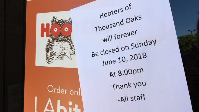 A "closed" sign greets would-be patrons at Hooters restaurant in Thousand Oaks.
