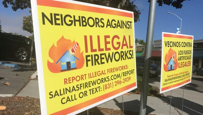 A sign advertising how to report illegal fireworks in Salinas.