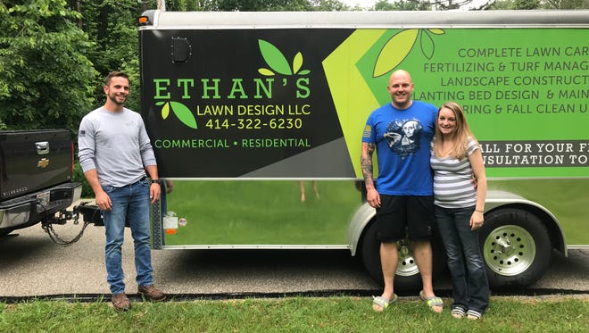 Ethan Henry (left) is doing free lawn care for Cody Apps (middle) and his pregnant wife, Carrie, until snowfall. Cody will be deployed to the Middle East the first week of July.