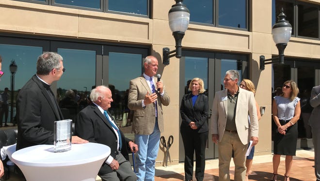 Sanford Health CEO Kelby Krabbenhoft speaks at the ribbon-cutting ceremony at the Sanford House on Tuesday. The Sanford House is a $6 million building to serve as the Sanford Foundation headquarters and a tribute to billionaire donor T. Denny Sanford.