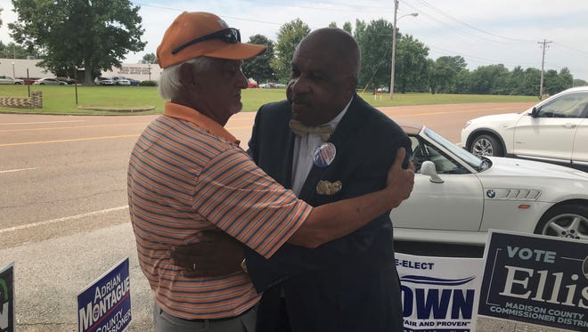 T. Robert Hill (left) and James Baxter hug in a sign of solidarity as the two Democratic candidates campaign for the party nomination in next week's primary election in the State Representative District 73 race.