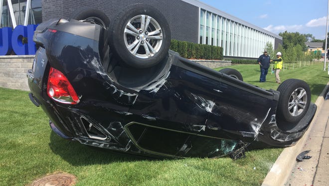 The vehicle of an Oakland County Sheriff's Office detective was overturned after a crash on Woodward Avenue in Pontiac the morning of Friday, Aug. 3, 2018.