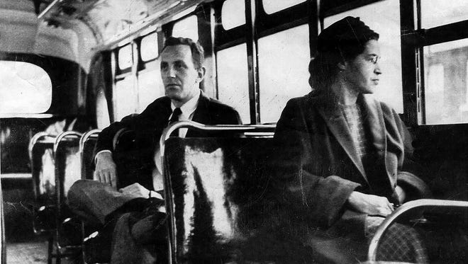 An undated photo shows Rosa Parks riding on the Montgomery Area Transit System bus. Parks refused to give up her seat on a Montgomery bus on Dec. 1, 1955, and ignited a boycott that led to a federal court ruling against segregation in public transportation.