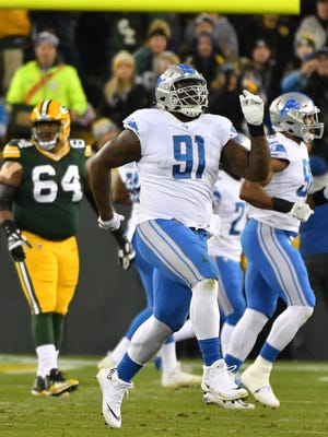 Lions' A'Shawn Robinson dances off the field after blocking a field-goal attempt in the first quarter against the Packers.