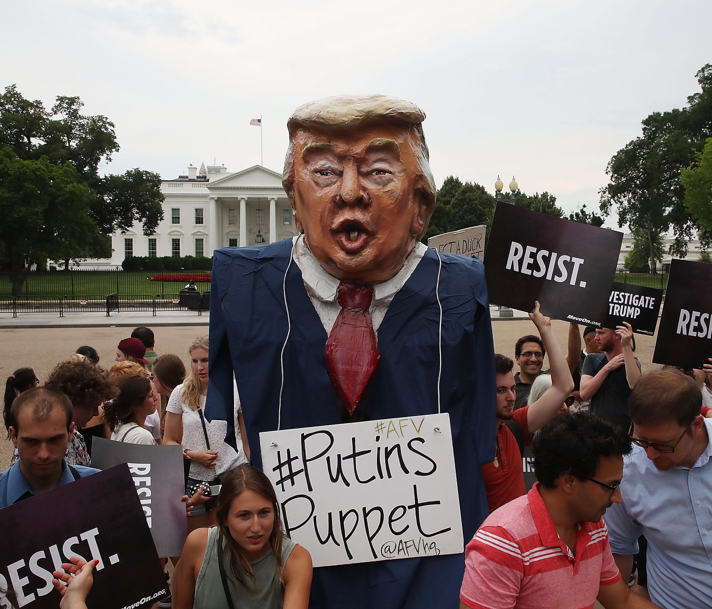 WASHINGTON, DC - JULY 11:  People protest against U.S. President Donald Trump in front of the White House on July 11, 2017 in Washington, DC. The group Moveon.org organized the protest against the president for his campaign's alleged contact with rep