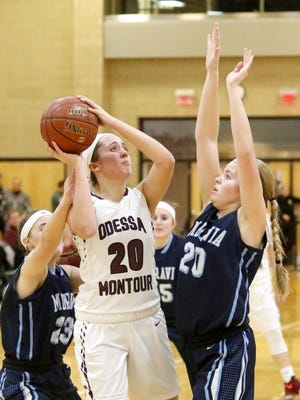 Olivia Grover gets set to shoot as Maddie Funk (20) and Kaelyn Stanton defend for Moravia on Friday during the IAC Small School final at Tompkins Cortland Community College.