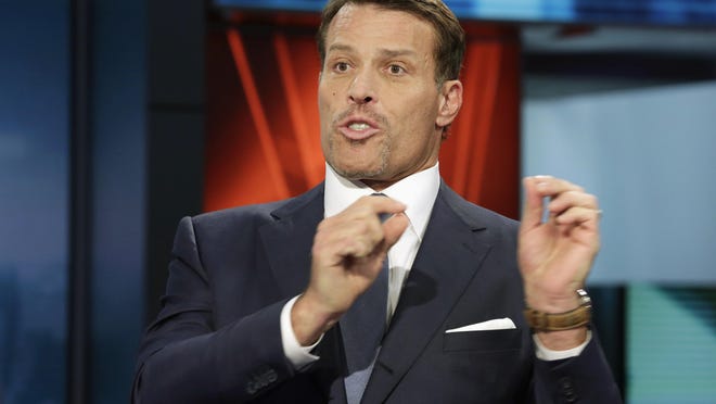 Fire officials say more than 30 people attending a Tony Robbins event Thursday in Dallas have been treated for burns after walking on hot coals at the event.