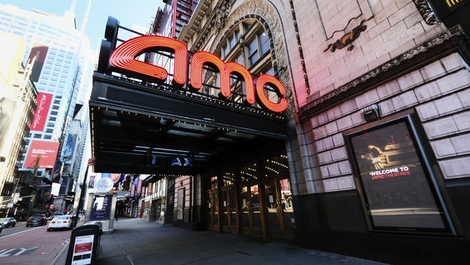 FILE - In this May 13, 2020 file photo, AMC Empire 25 theatre appears on 42nd Street in New York. The nation's largest movie theater chain changed its position on mask-wearing less than a day after the company became a target on social media for saying it would defer to local governments on the issue. AMC Theaters CEO Adam Aron said Friday that its theaters will require patrons to wear masks upon reopening, which will begin in July.